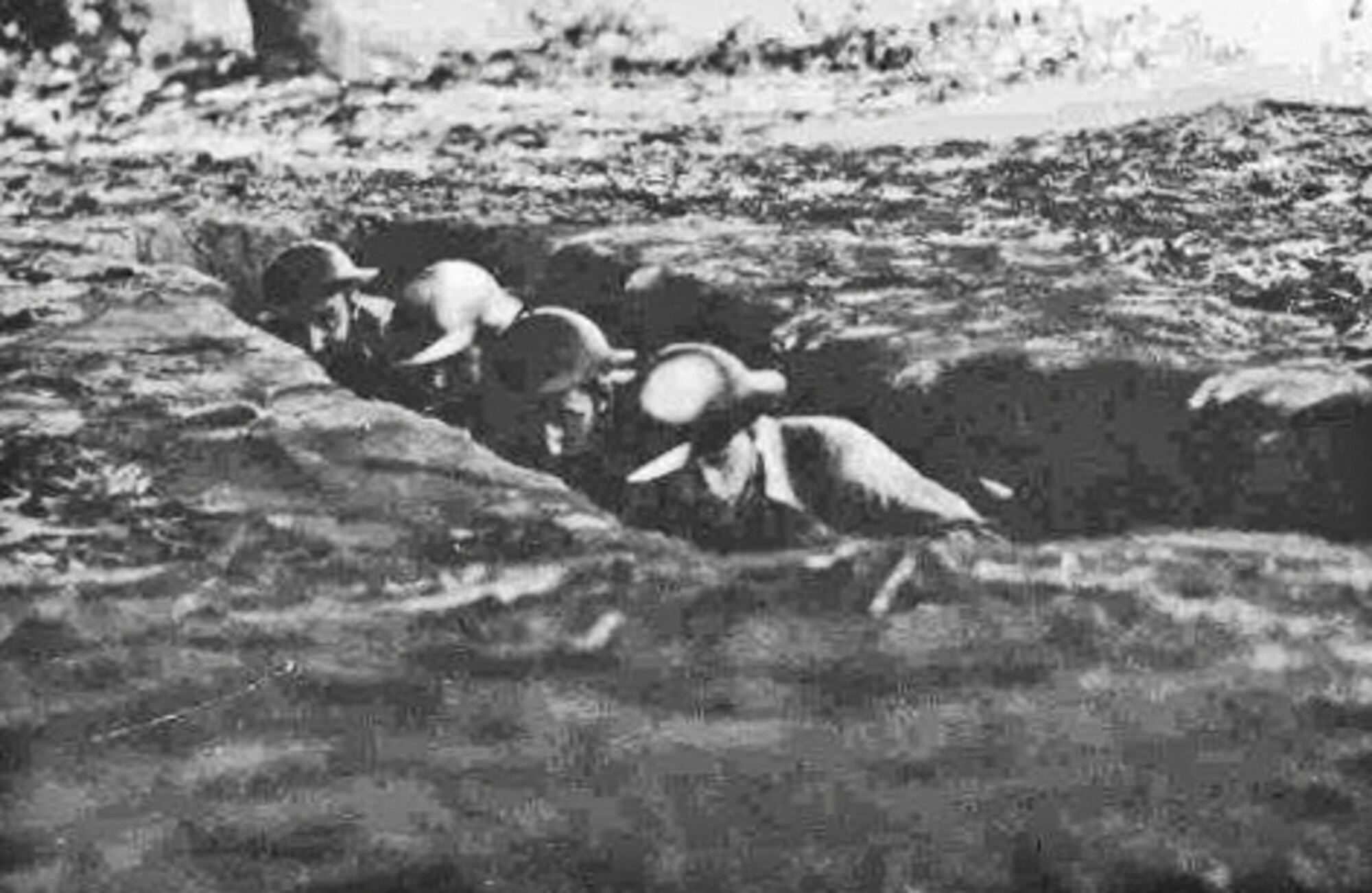 James J. Bollich (second from the right) in a trench during World War II. (Courtesy Photo)
