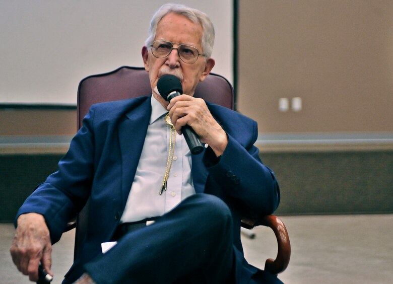 James J. Bollich speaks to audience members in the 336th training Group auditorium about his time as a prisoner of war at Fairchild Air Force Base, Washington, June 26, 2014. Bollich was a prisoner of war during World War II and a survivor of the Bataan Death March. Members of Fairchild listened to Bollich speak about how Survival, Evasion, Resistance and Escape training saved his life and the importance of their training. (U.S. Air Force photo by Staff Sgt. Alexandre Montes)