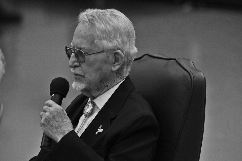 James J. Bollich speaks to audience members in the 336th training Group auditorium about his time as a prisoner of war at Fairchild Air Force Base, Washington, June 26, 2014. Bollich was a prisoner of war during World War II and a survivor of the Bataan Death March. Members of Fairchild listened to Bollich speak about how Survival, Evasion, Resistance and Escape training saved his life and the importance of their training. (U.S. Air Force photo by Staff Sgt. Alexandre Montes)