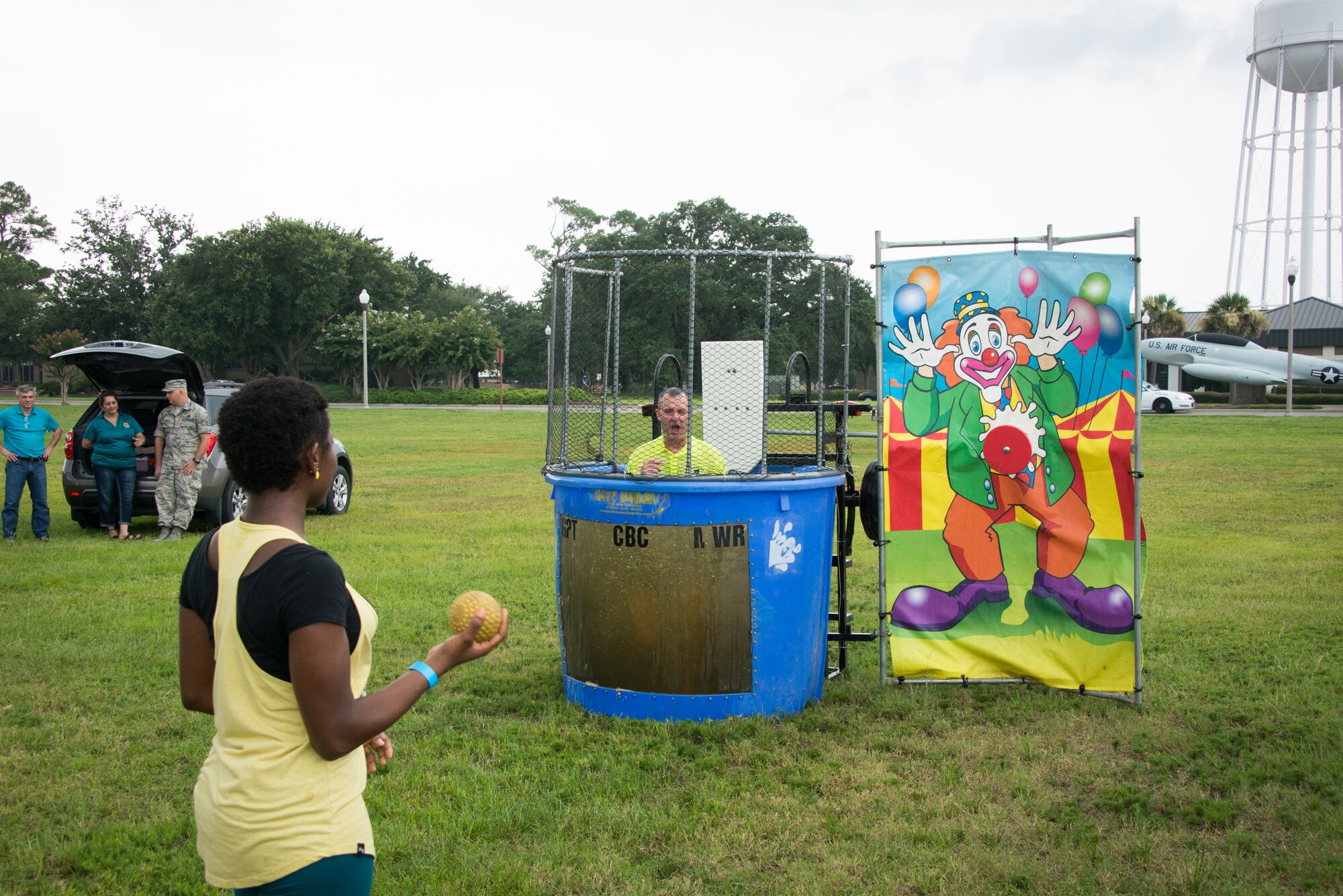 Airman First Class Brittaney Bogle, 403rd Wing, dunks Master Sgt. Charles Sargent, 81st Medical Support Squadron, during a block party July 25, 2014, next to the Shaw House, Keesler Air Force Base, Miss.  The event, hosted by the Airman's Council and the Dorm Council, was open to all ranks and benefitted the 81st Training Wing Airmen recognition fund. (U.S. Air Force photo by Marie Floyd)