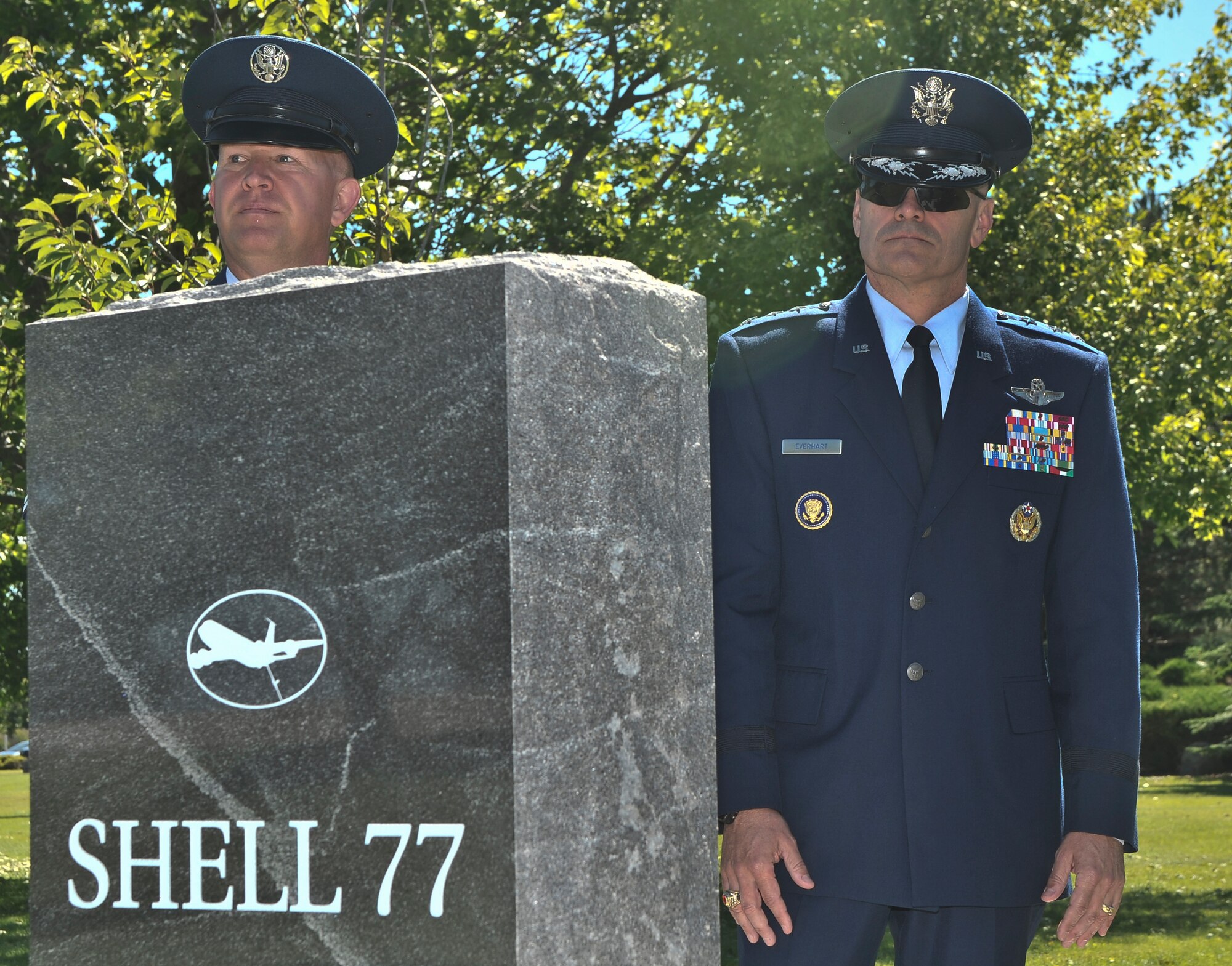 Lt. Gen. Carlton Everhart and Chief MSgt. Robert Rodewald read the names of the crew on the ‘Shell 77’ memorial during the 18th Air Force command visit at Fairchild Air Force Base, Washington, July 25, 2014. Everhart is the 18th Air Force commander and Rodewald is the 18th Air Force Command CMSgt. (U.S. Air Force photo by Staff Sgt. Alexandre Montes/Released)