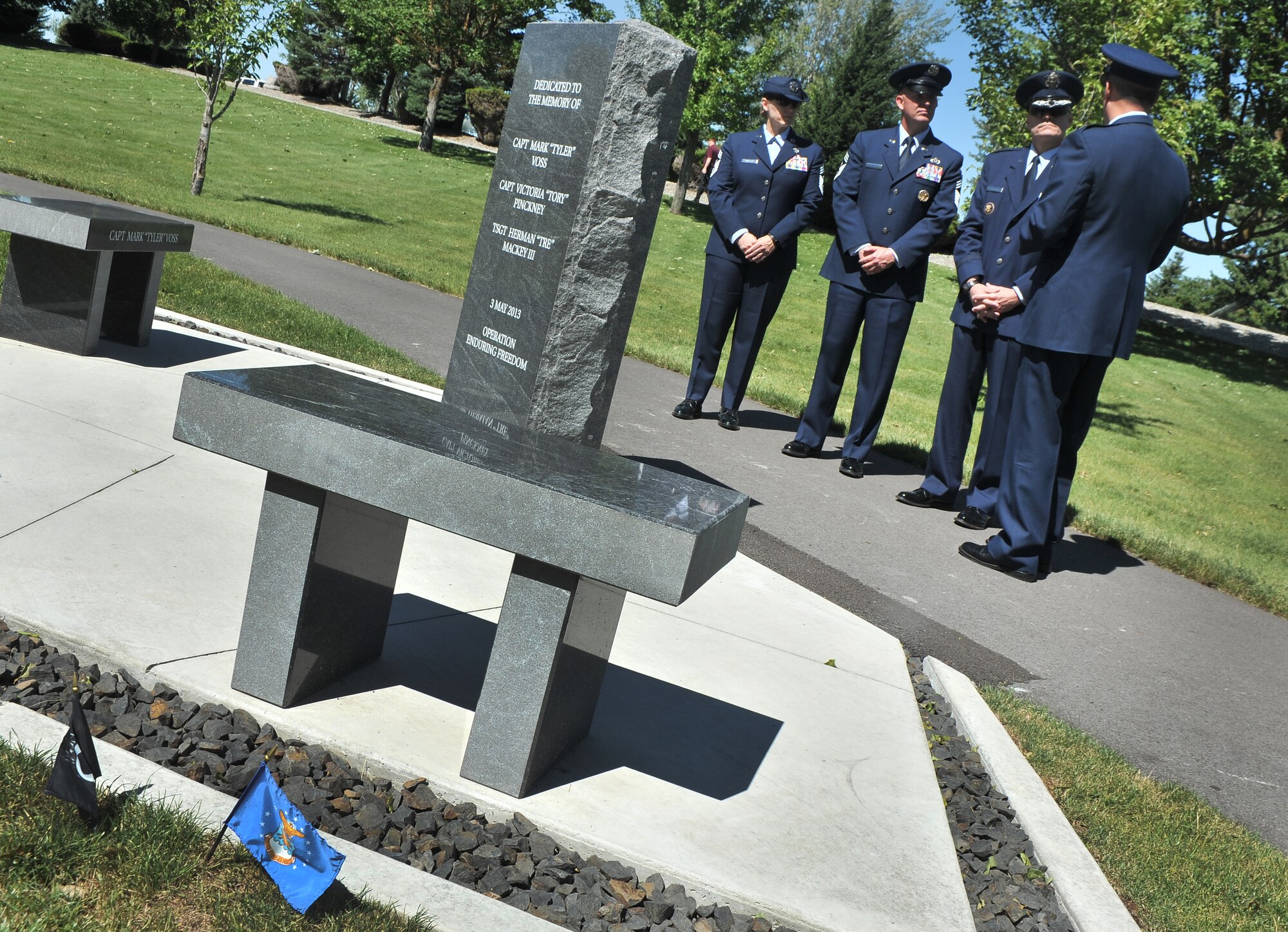 Col. Brian M. Newberry and Chief MSgt. Wendy Hansen give Lt. Gen. Carlton Everhart and Chief MSgt. Robert Rodewald a tour of the ‘Shell 77’ memorial during the 18th Air Force command visit at Fairchild Air Force Base, Washington, July 25, 2014. Everhart is the 18th Air Force commander and Rodewald is the 18th Air Force Command CMSgt. (U.S. Air Force photo by Staff Sgt. Alexandre Montes/Released)