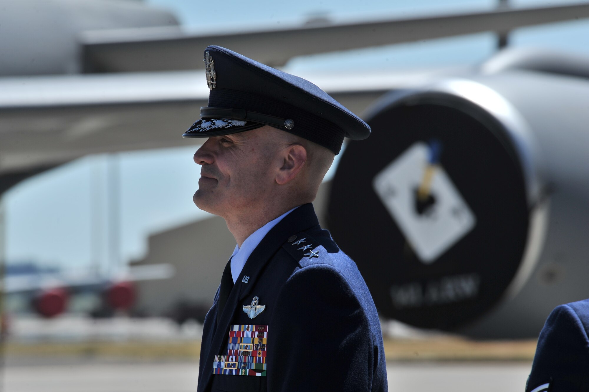 Lt. Gen. Carlton Everhart waits to enter as part of the official party during the 92nd Air refueling wing Change of command at Fairchild Air Force Base, Washington, July 25, 2014. The change of command ceremony is a tradition that represents a formal transfer of authority and responsibility. Everhart is the 18th Air Force commander. (U.S. Air Force photo by Staff Sgt. Alexandre Montes) 