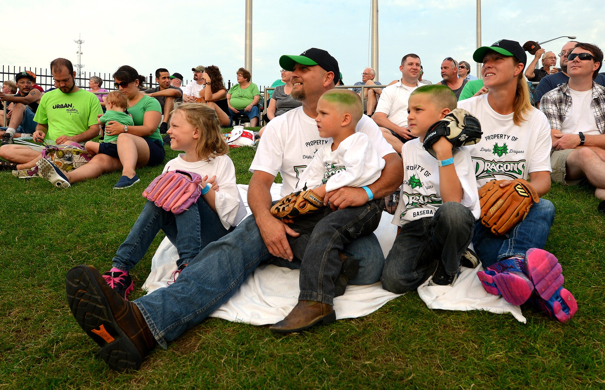 DAYTON, Ohio – Tech. Sgt. Nichole Morris, 445th Maintenance Squadron aircraft structural maintenance craftsman, and her husband, John, and their children enjoy watching a Dayton Dragons baseball game July 12, 2014. 445th Maintenance Group reservists and their families spent the evening at the game to help enhance unit morale. The Dayton Dragons are a Class A minor league baseball team affiliated with the Cincinnati Reds. (U.S. Air Force photo/Tech. Sgt. Frank Oliver)