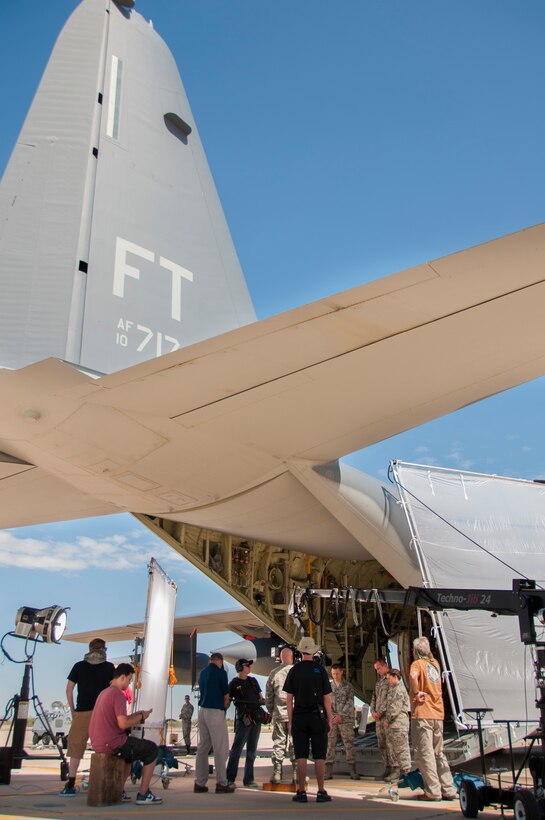 Cast and crew members rehearse a scene during the filming of a chaplain recruiting advertisement being produced by the Air National Guard Recruiting Creative Marketing team at Davis-Monthan Air Force Base July 16, 2014. (U.S. Air National Guard photo by Staff Sgt. Heather Davis/Released)