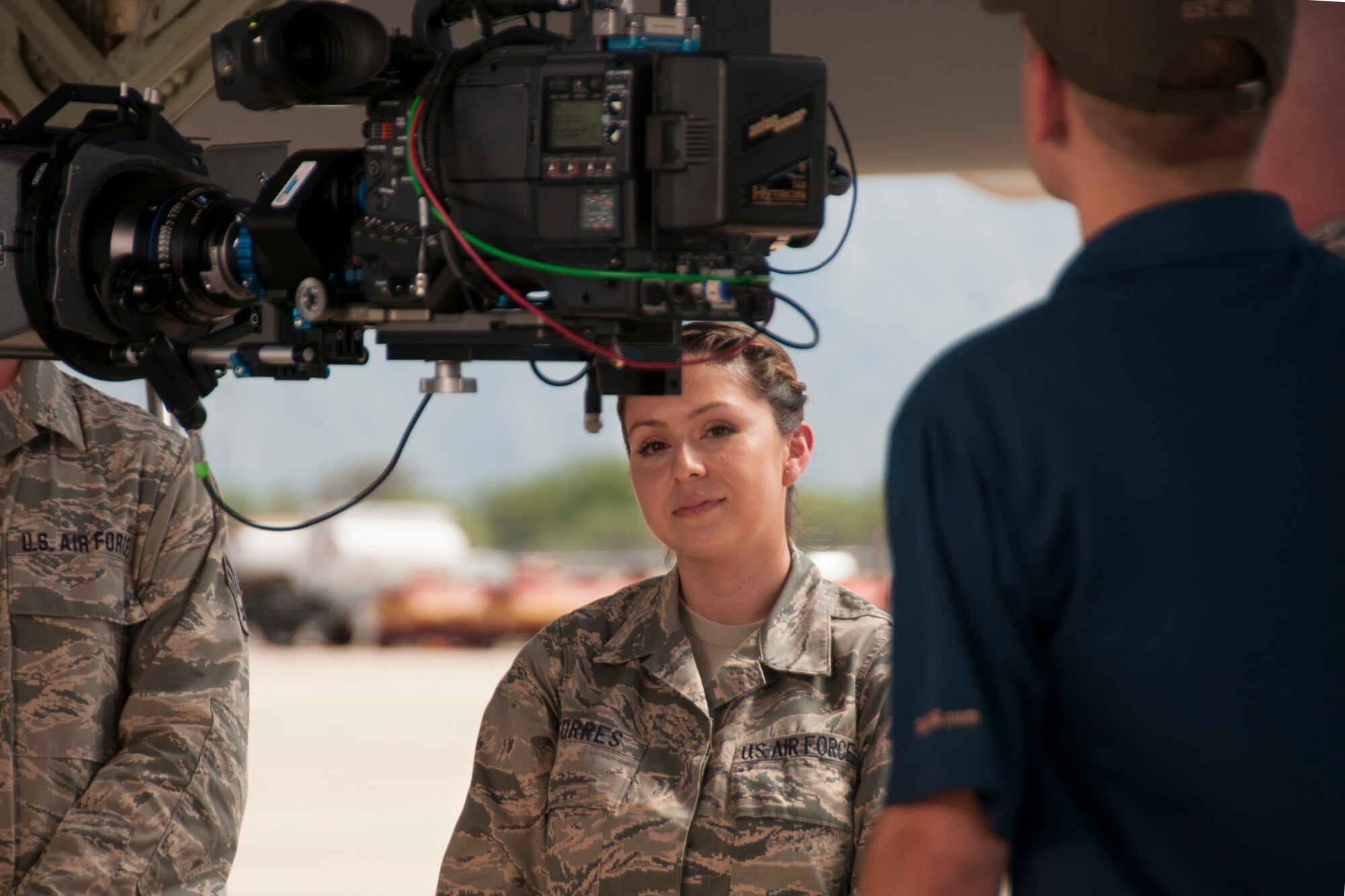Tech Sgt. Priscilla Torres, command support staff member with the 162nd Mission Support Group, prepares for her scene during the filming of an Air National chaplain recruiting advertisement at Davis-Monthan Air Force Base July 16, 2014. The advertisement is being produced by the Air National Guard Recruiting Creative Marketing team. (U.S. Air National Guard photo by Staff Sgt. Heather Davis/Released)