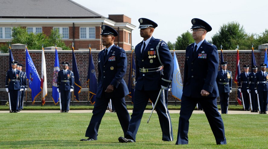 Maj. Scott Belton (center) escorts Col. Michael Saunders (left) and Col. Kendell Peters (right) as they review the U.S. Air Force Honor Guard during the Air Force Element change of command ceremony on the Joint Base Anacostia-Bolling Ceremonial Lawn in Washington July 29, 2014. Peters, the new Air Force Element commander, assumed command from Saunders during the ceremony. Belton is the U.S. Air Force Honor Guard assistant director of operations. (U.S. Air Force photo/Master Sgt. Tammie Moore)