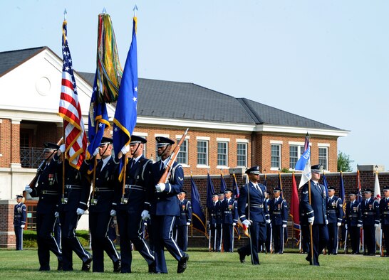 Members of the U.S. Air Force Honor Guard Color Team present the colors during the Air Force Element change of command ceremony on the Joint Base Anacostia-Bolling Ceremonial Lawn in Washington July 29, 2014. The Air Force Element at JBAB provides joint installation support to more than 16,000 military and civilian employees and their families throughout the National Capital Region. (U.S. Air Force photo/Master Sgt. Tammie Moore)
