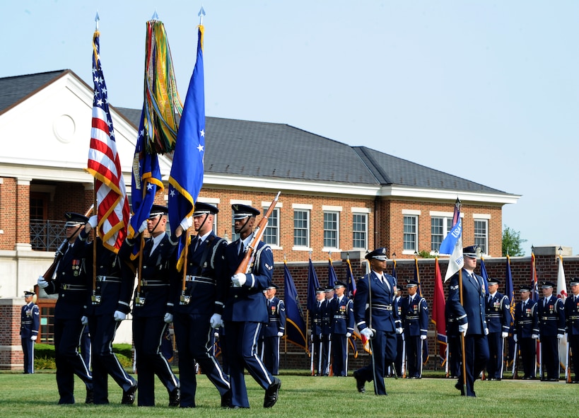 Members of the U.S. Air Force Honor Guard Color Team present the colors during the Air Force Element change of command ceremony on the Joint Base Anacostia-Bolling Ceremonial Lawn in Washington July 29, 2014. The Air Force Element at JBAB provides joint installation support to more than 16,000 military and civilian employees and their families throughout the National Capital Region. (U.S. Air Force photo/Master Sgt. Tammie Moore)