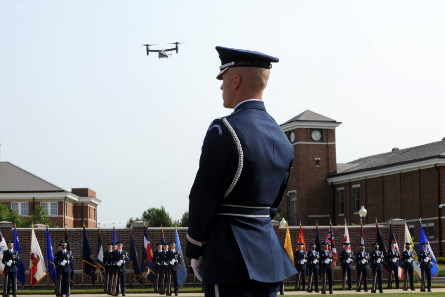 A V-22 Osprey flies over members of the U.S. Air Force Honor Guard Color during the Air Force Element change of command ceremony on the Joint Base Anacostia-Bolling Ceremonial Lawn in Washington July 29, 2014. The 1,018-acre joint base is home to 48 mission and tenant units, including the U.S. Air Force Honor Guard and Band, the Navy Ceremonial Guard, the Defense Intelligence Agency and the White House Communications Agency. (U.S. Air Force photo/Master Sgt. Tammie Moore)