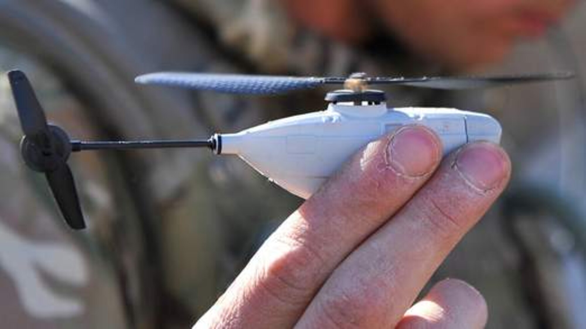 A British Soldier holds Prox Dynamics' PD-100 Black Hornet, a palm-sized miniature helicopter weighing only 16 grams. Researchers with the U.S. Army Natick Soldier Research, Development and Engineering Center are testing the Black Hornet to provide squad-sized small units with organic intelligence, surveillance, and reconnaissance capability. (Photo courtesy of United Kingdom Ministry of Defense)