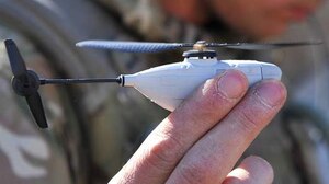A British Soldier holds Prox Dynamics' PD-100 Black Hornet, a palm-sized miniature helicopter weighing only 16 grams. Researchers with the U.S. Army Natick Soldier Research, Development and Engineering Center are testing the Black Hornet to provide squad-sized small units with organic intelligence, surveillance, and reconnaissance capability. (Photo courtesy of United Kingdom Ministry of Defense)