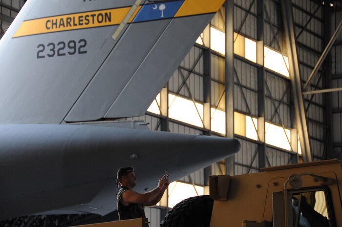 JOINT BASE CHARLESTON, S.C. – Chief Master Sgt. Mark Bronson, 628th Air Base Wing command chief, arrives in style atop a Light Medium Tactical Vehicle during the 2014 Triple Pack Combat Dining Out ceremony July 26, 2014, at Joint Base Charleston, S.C. The Dining Out custom is rooted in military history and tradition, and affords service members the chance to bond over food, drink and activities. The “Combat” element of the Dining Out added an informal twist and involved costumes, an obstacle course and a water fight. (U.S. Air Force photo/1st Lt. Christopher Love)