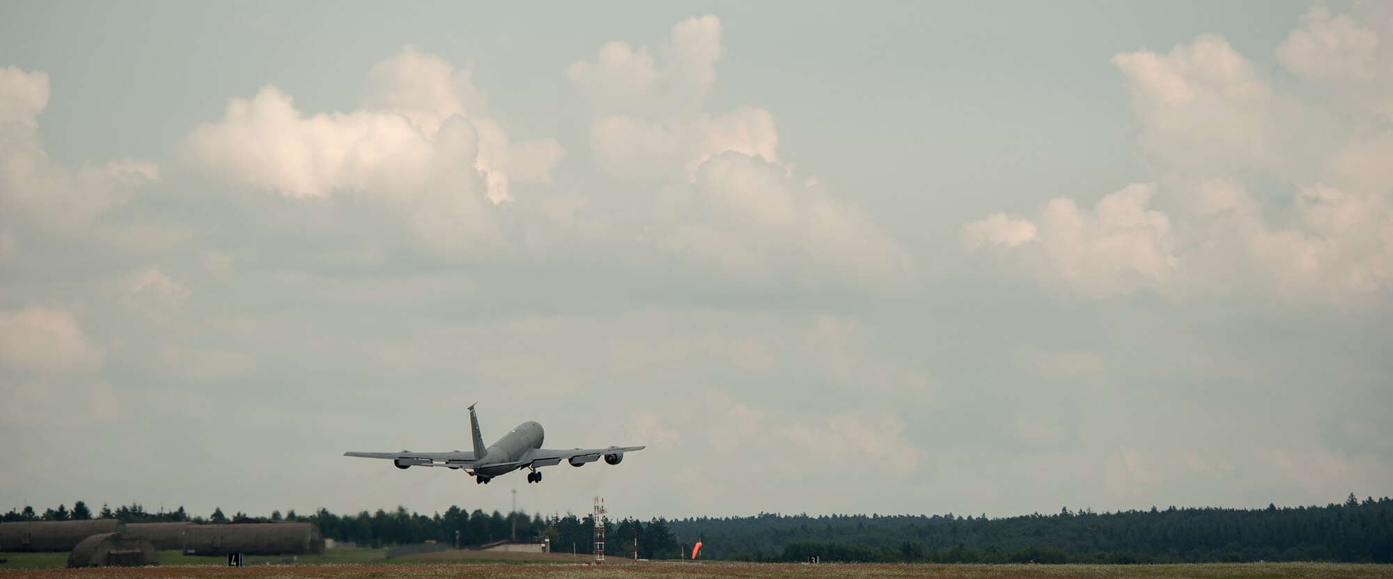 A U.S. Air Force KC-135 Stratotanker assigned to the 100th Air Refueling Wing at Royal Air Force Mildenhall, England, takes off from Spangdahlem Air Base, Germany, July 25, 2014. The tanker refueled F-16 Fighting Falcon fighter aircraft assigned to Spangdahlem during a two-day training mission. (U.S. Air Force photo by Senior Airman Rusty Frank/Released)