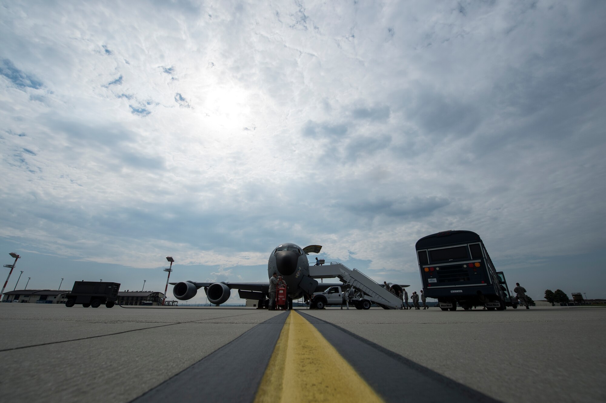 Spangdahlem Airmen and family members, board a U.S. Air Force KC-135 Stratotanker on the flightline July 25, 2014, at Spangdahlem Air Base, Germany. Base Airmen and spouses witnessed aerial refueling operations of an F-16 Fighting Falcon fighter aircraft. (U.S. Air Force photo by Senior Airman Rusty Frank/Released)