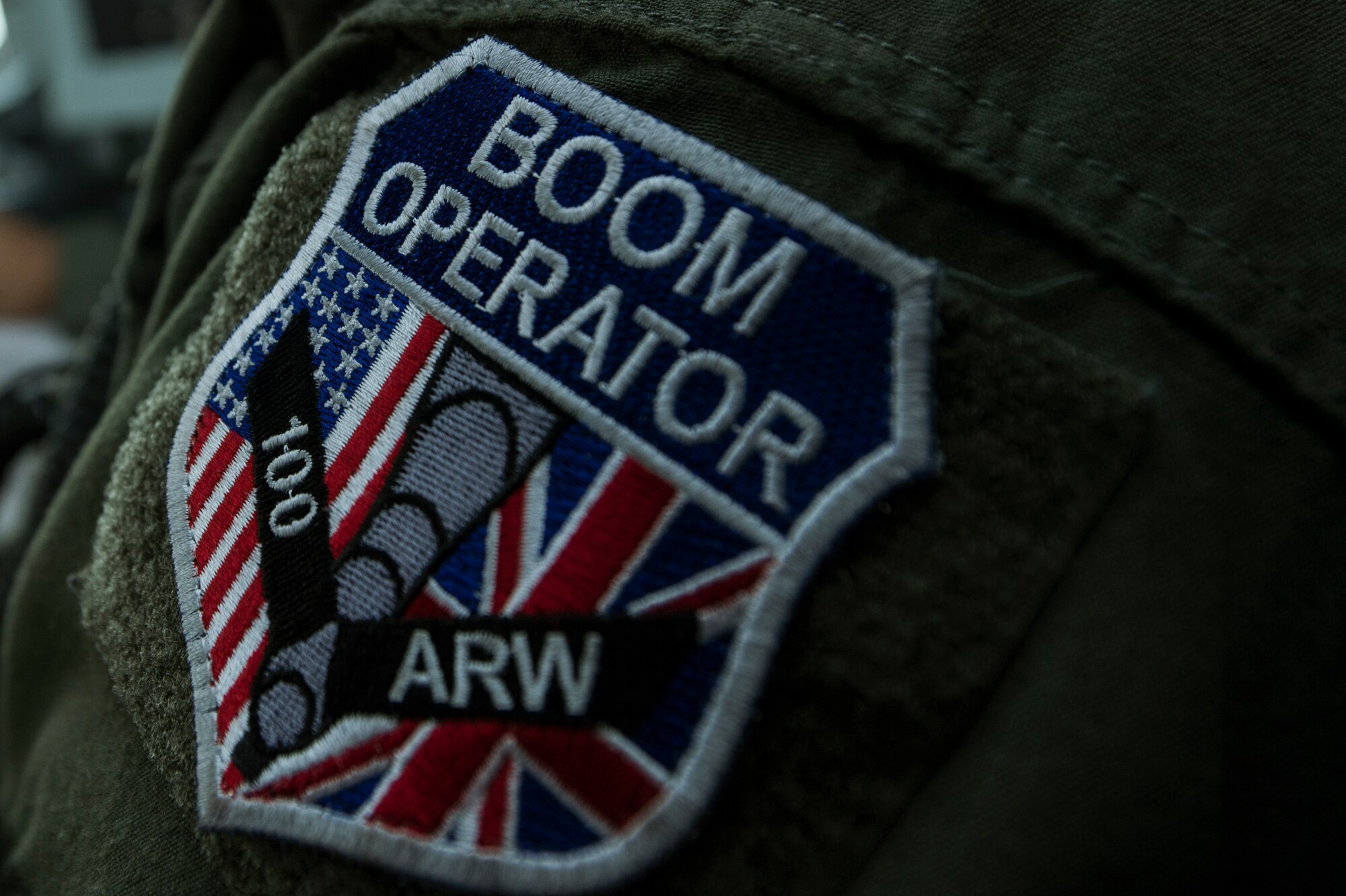 A patch is displayed on the shoulder of U.S. Air Force Staff Sgt. Michael Einland, a 351st Air Refueling Squadron in-flight refueling journeyman from Omaha, Neb., assigned to Royal Air Force Mildenhall, England, July 24, 2014, at Spangdahlem Air Base, Germany. An aircrew from RAF Mildenhall provided aerial refueling operations for a joint training exercise with the 480th Fighter Squadron. (U.S. Air Force photo by Senior Airman Rusty Frank/Released)