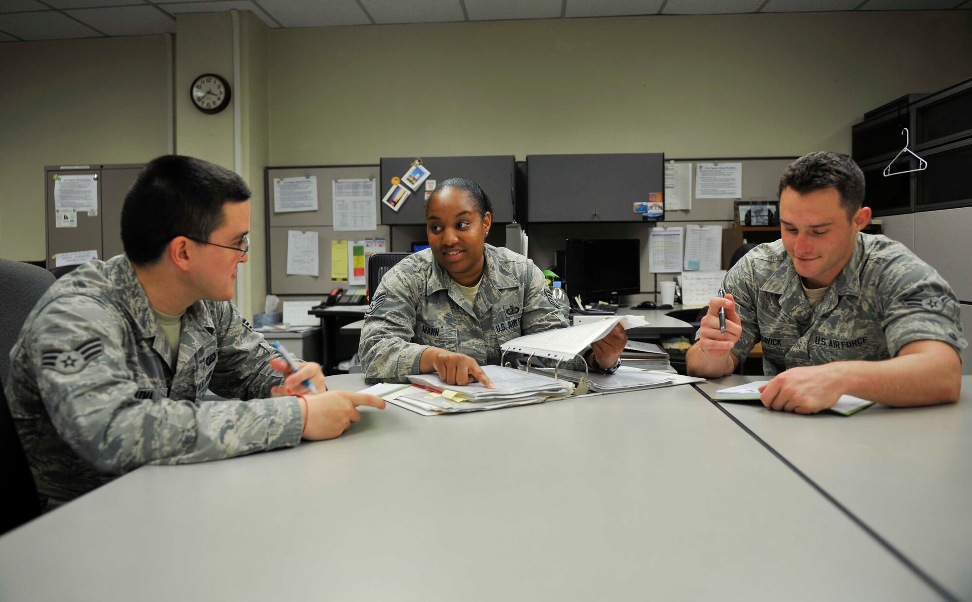 Staff Sgt. Tameka Mann, 51st Comptroller Squadron Maintenance and Operations Group budget analyst, trains Airmen on different budget analyst duties on Osan Air Base, Republic of Korea, July 16, 2014. Mann is this week's Airman Spotlight winner. (U.S. Air Force photo by Senior Airman David Owsianka)