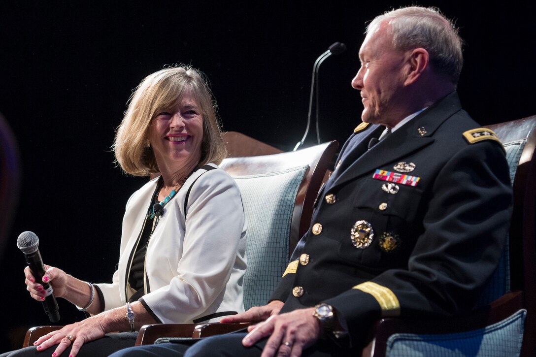 Army Gen. Martin E. Dempsey, chairman of the Joint Chiefs of Staff, and his wife, Deanie,  speak at the Military Education Coalition 2014 National Training Seminar in Washington D.C., July 29, 2014. 