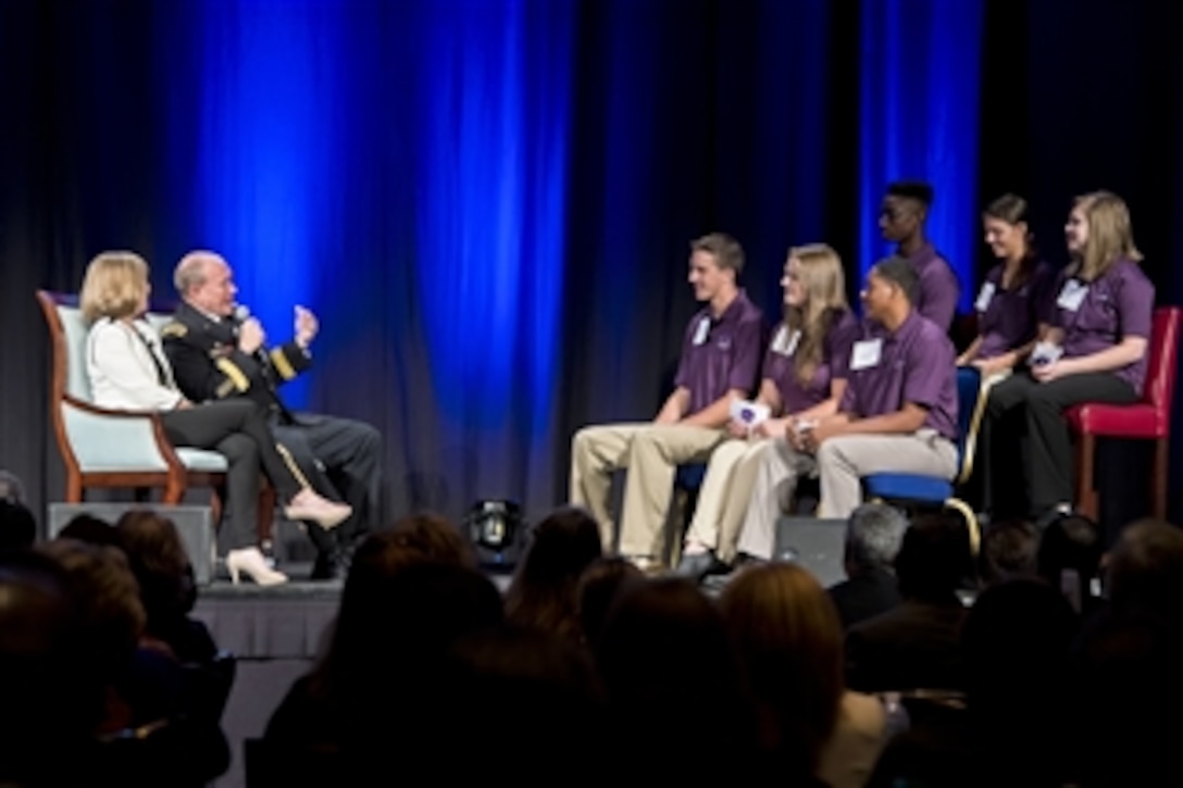 Army Gen. Martin E. Dempsey, chairman of the Joint Chiefs of Staff, and his wife, Deanie, speak to children at the Military Child Education Coalition's annual training seminar in Washington, D.C., July 29, 2014. The coalition works with national experts in child development, education and health to support military children. The children on stage were selected for their work with the organization.