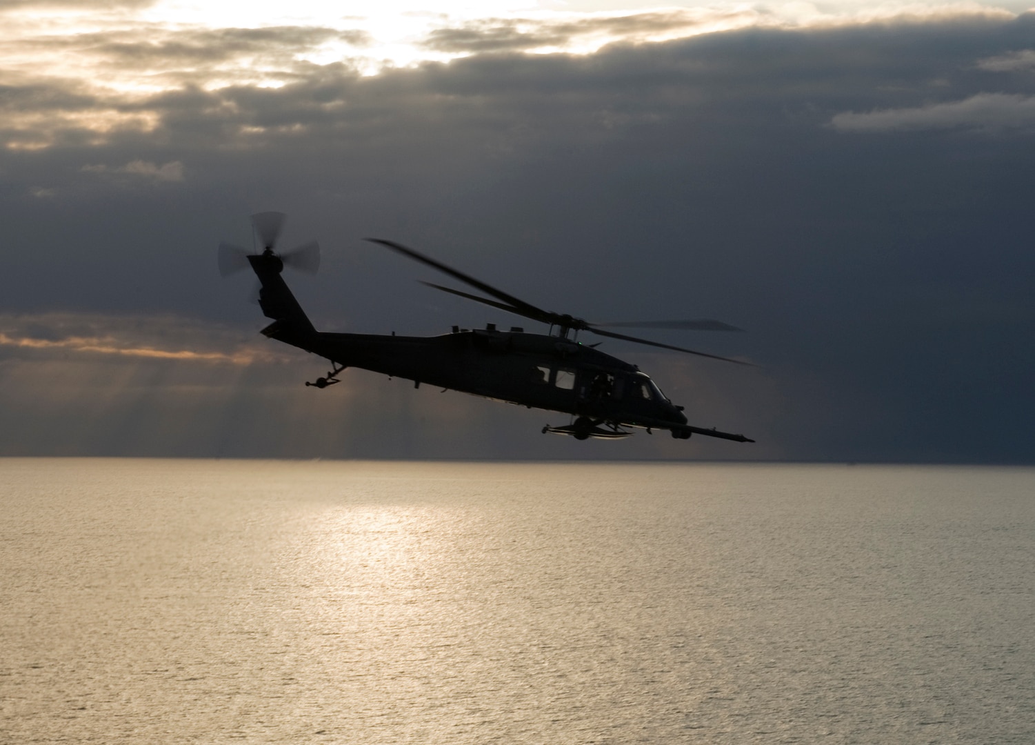 An Alaska Air National Guard HH-60 Pave Hawk combat search and rescue helicopter from the 210th Rescue Squadron flies over Cook Inlet April 30, 2013. Airmen with the Alaska Air National Guard’s 210th, 211th and 212th Rescue Squadrons assisted July 28, 2014, with the transportation of a pregnant woman in labor from Nulato, Alaska.