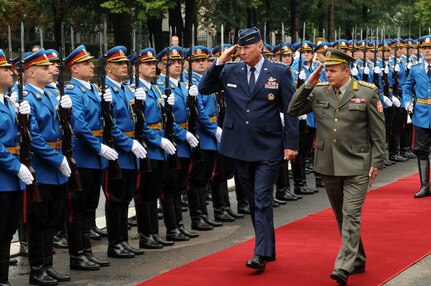 Air Force Gen. Craig McKinley, the chief of the National Guard Bureau, and Serbian Army Lt. Gen. Miloje Miletic, chief of staff of the Serbian Armed Forces, review Serbian troops following McKinley's arrival in Belgrade, Serbia, on Sept. 10, 2010, for National Guard State Partnership Program activities.