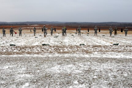 Citizen-Soldiers from the 702 Military Police Company, Task Force Raptor (3-124 CAV), on the reflexive fire range at Camp Atterbury, Ind., on Jan. 12, 2012. The Texas National Guard members from the task force are deploying to the Horn of Africa early this year.