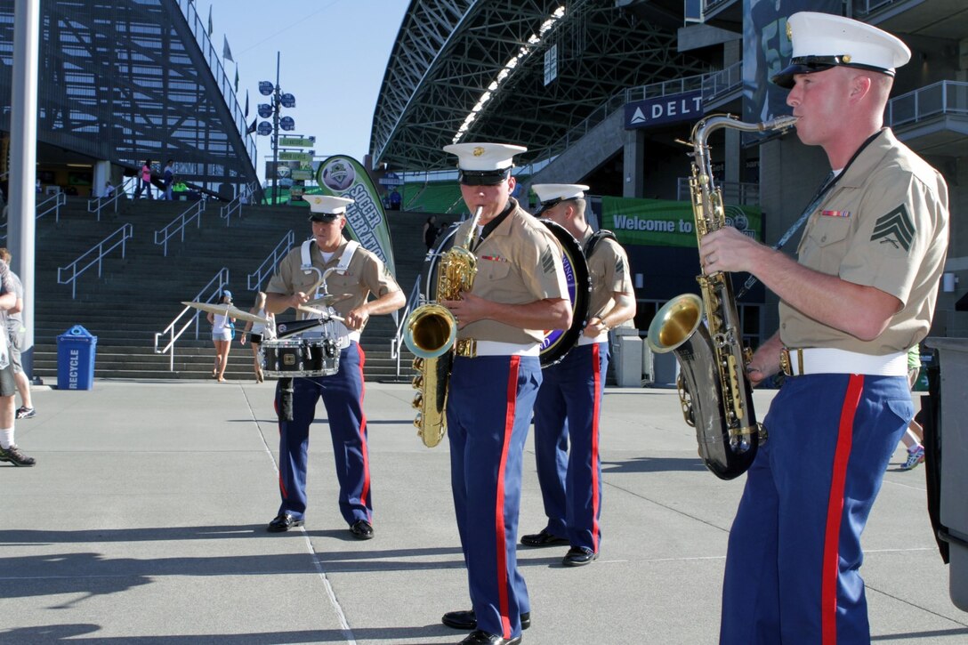 Marines with the 3rd Marine Aircraft Wing Band's "Party Band" give a performance to the crowd at the CenturyLink Field in Seattle, July 28 as a part of Marine Week Seattle 2014. The Marines performed outside the stadium prior to the start of the Seattle Sounders soccer game. Marine Week Seattle showcases Marine Corps equipment, aircraft and technological capabilities to the general public. More than 700 Marines are participating in Marine Week Seattle to give Seattleites the opportunity to meet the individual Marine and celebrate community, country and Corps. (U.S. Marine Corps photo by Cpl. Brandon Suhr/Released)