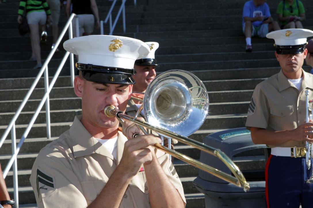 Corporal Matthew Hall, a musician with the 3rd Marine Aircraft Wing Band and a resident of Kingsport, Tenn., plays his trombone during a solo of a performance at the CenturyLink Field in Seattle, July 28 as a part of Marine Week Seattle 2014. The band performed outside the stadium prior to the start of the Seattle Sounders soccer game. Marine Week Seattle showcases Marine Corps equipment, aircraft and technological capabilities to the general public. More than 700 Marines are participating in Marine Week Seattle to give Seattleites the opportunity to meet the individual Marine and celebrate community, country and Corps. (U.S. Marine Corps photo by Cpl. Brandon Suhr/Released)