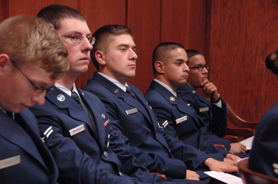 Airmen listen to opening statements during a ‘mock trial’ held June 19, 2014, inside the Offutt Air Force Base Courtroom, Neb. All Airmen attending the week-long First Term Airmen’s Center orientation course will participate in a mock trial as part of their training. The 55th Wing Legal Office created the program with the goal of preventing sexual assault through education and awareness. (U. S. Air Force photo/Delanie Stafford)
