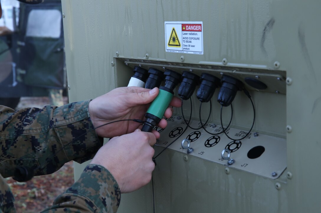 Marine from 8th Communication Battalion finishes setting up his Very Small Aperture Terminal (VSAT-L) display at the II Marine Headquarters Group Enabler Battalion Expo on January 15. 8th Communications Bn featured a VSAT-L, a two way satellite used to send transmissions to other ground satellites.