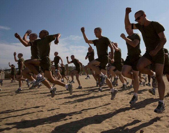 Recruits of Fox Company conduct a warm up that included several exercises such as sprints, high knees and side shuffles before starting the physical fitness session at Marine Corps Recruit Depot San Diego, July 28. The purpose of this physical fitness session was to show each recruit what areas of fitness he needs to improve on before the initial physical fitness test.
