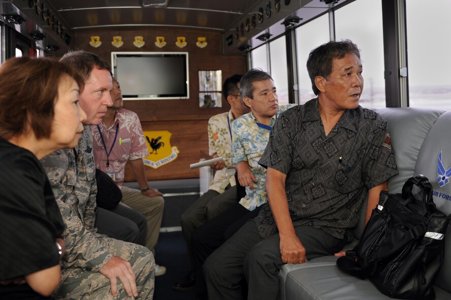 Kurayoshi Takara, vice governor of Okinawa, and his team view Kadena’s flightline during a driving tour on Kadena Air Base, Japan, July 30, 2014. During the tour, Takara visited sacred and historical sites on base in addition to learning about the 18th Wing’s mission and role as the Keystone of the Pacific. (U.S. Air Force photo by Airman 1st Class Zade C. Vadnais/Released)
