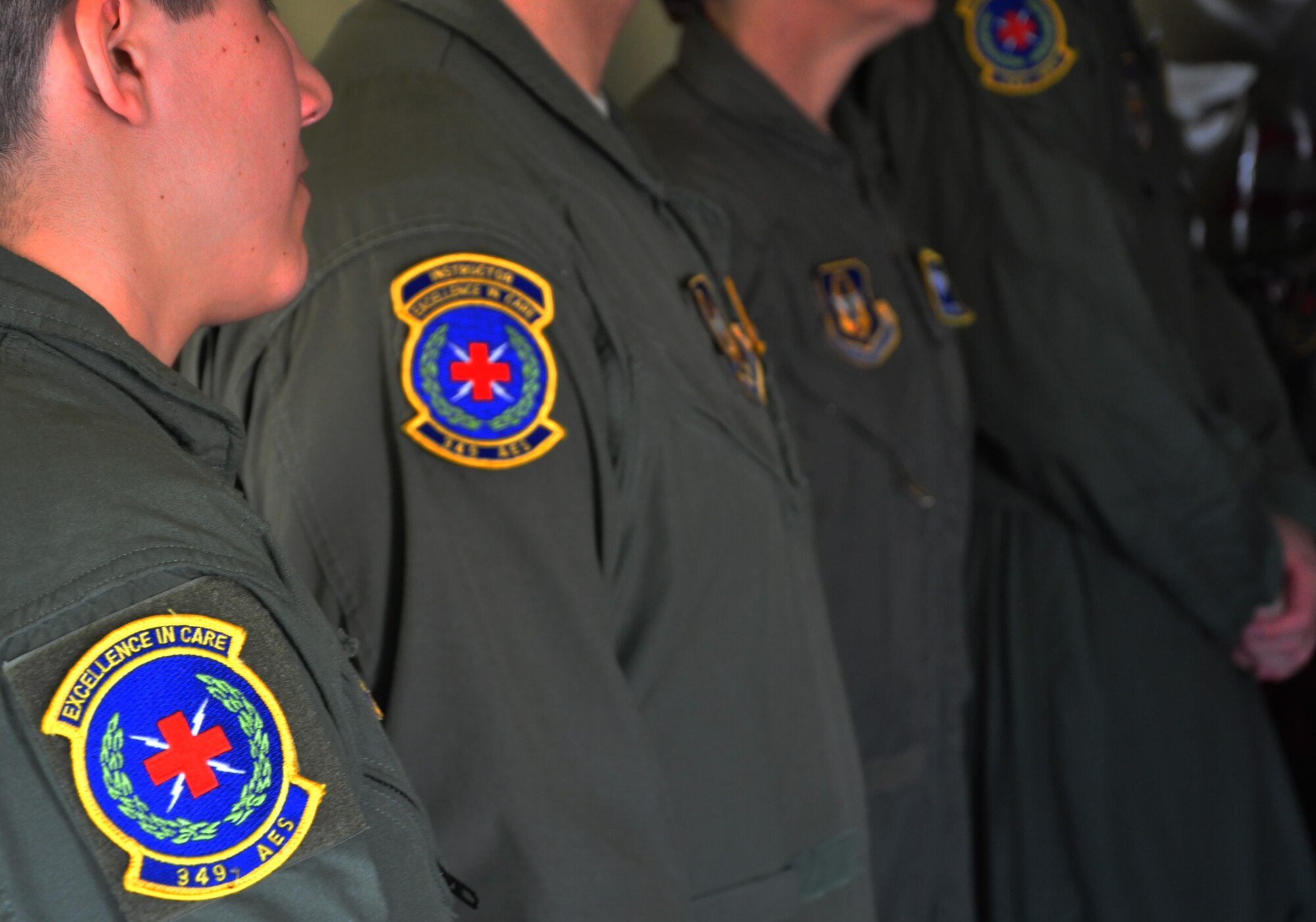 Members of the 349th Aeromedical Evacuation Squadron listen to a passenger safety briefing before taking of on a training mission at Travis Air Force Base, Calif., July 25, 2014.  The unit typically utilizes two to three missions a month, simulating a variety of aircraft emergencies, including fires which require the AETs to don MA1 Oxygen bottles and their quick don gas masks.  (U.S. Air Force photo by Staff Sgt. Abigail Klein)
