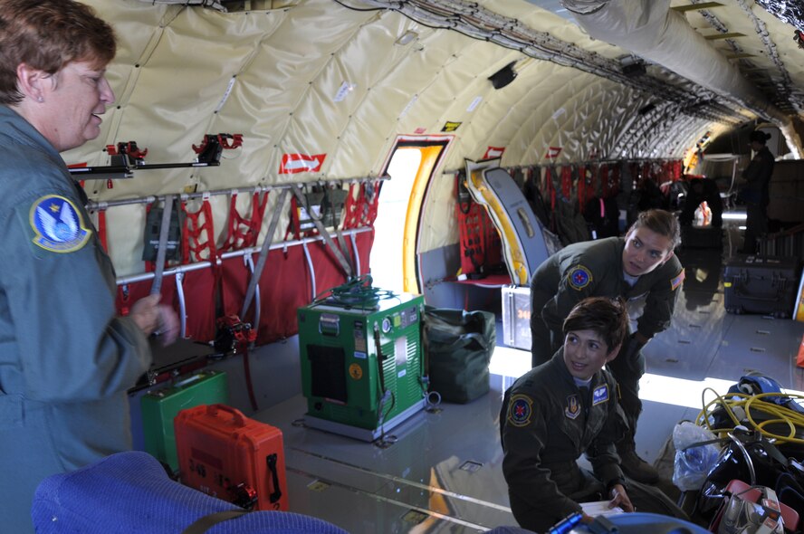 (Left to right) Chief Master Sgt. Kathy Lowman, acting 931st ARG superintendent and 18 Air Refueling Squadron boom operator, briefs Capt. Maria Vazquez, 349th Aeromedical Evacuation Squadron medical crew director, and Senior Airman Shelby Adney, 349th AES technician, on their upcoming flight on a McConnell KC-135 Stratotanker at Travis Air Force Base, Calif., July 25, 2014. Tanker aircraft began augmenting the Air Force's aeromedical evacuation mission in 2003, demonstrating the versatility of both the airframe and the crews who fly it.  Aeromedical members from the Reserve represent 65 percent of the total medical crew capability in the Air Force. (U.S. Air Force photo by Staff Sgt. Abigail Klein)