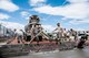 Airmen with the 50th and 911th Civil Engineer Squadron work together to complete a cement pad for the Outdoor Recreation vehicle parking lot July 25, 2014, at Schriever Air Force Base, Colo. Thirty-two 911 CES reservists with eight different Air Force Specialty Codes, such as electricians, utilities, heavy equipment operators, operations and management, integrated into 50 CES shops and worked alongside Schriever Airmen on various 50 CES projects. (U.S. Air Force photo/Staff Sgt. Julius Delos Reyes)