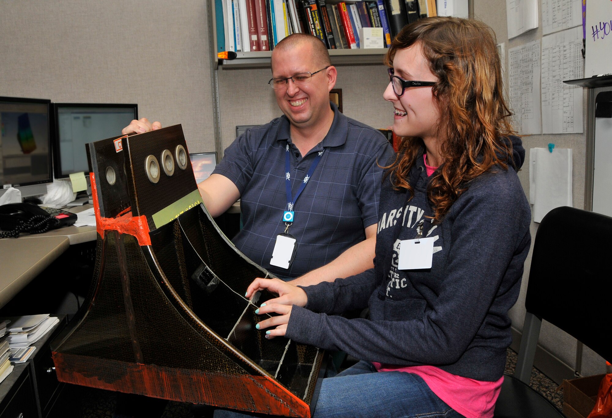 Willow Gernaat spent Job Shadow Day shadowing her father, Christopher Gernaat and learning about what he does at Arnold Engineering Development Complex (AEDC). Pictured is Willow holding a spacer which separates the compressor blades in the 16-foot Transonic wind tunnel’s compressor.