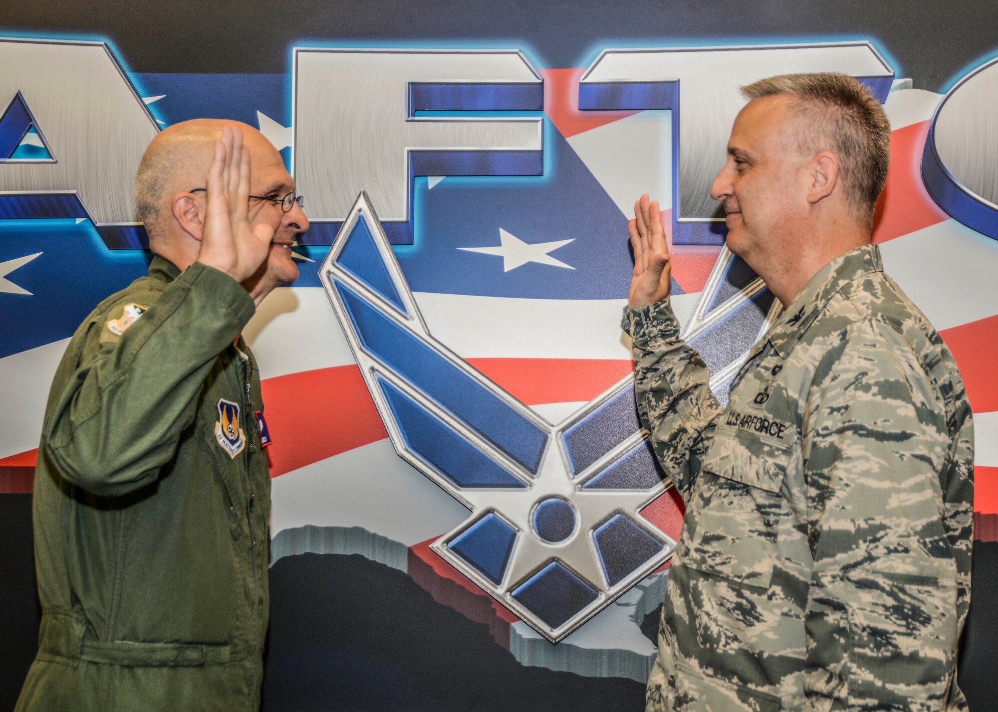 Maj. Gen. Arnold Bunch Jr., Air Force Test Center commander (left), swears in the new Air Force Test Center Inspector General Col. Christopher Wheeler July 30 in Bldg. 1. (U.S. Air Force photo by Rebecca Amber)
