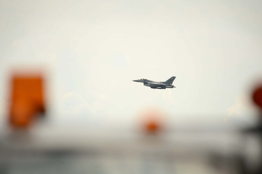 A U.S. Air Force F-16CJ Fighting Falcon flies through the sky at Shaw Air Force Base, S.C., July 30, 2014. The F-16CJ is a single-seat, multi-mission fighter aircraft, capable of generating up to 31,000 pounds of thrust and can fly at speeds in excess of Mach 2. (U.S. Air Force photo by Airman 1st Class Jensen Stidham/Released) 
