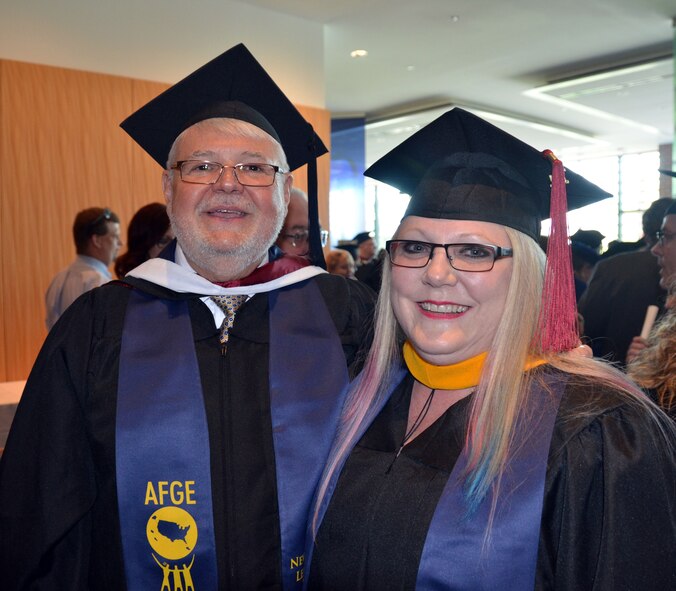 Jenyfer Johnson, 20th Civil Engineer Squadron hazardous material and waste manager takes a photo with Jay Cox, American Federation of Government Employees national president, Silver Spring, Md., April 26, 2014. Johnson was afforded the opportunity to attend the National Labor College to work towards her bachelor’s degree in emergency response.