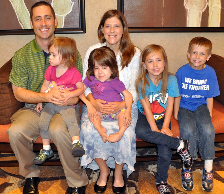 Senior Airrman Samuel Taylor and his wife, Elisabeth, take a break during an Air Force Reserve Yellow Ribbon training event July 20, 2014, in Costa Mesa, Calif., with their children (l to r):  Stephanie, Mara Jade, Kathrine and John. Yellow Ribbon events are held regularly and help reservists who will deploy, or have recently returned from a deployment, by offering a variety of briefings on finances, legal issues and what to expect.  (U.S. Air Force photo by Staff Sgt. Abigail Klein)