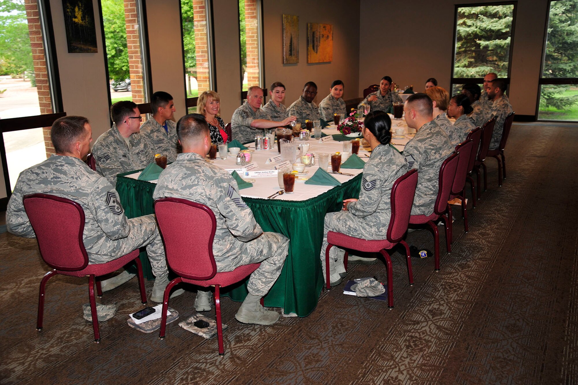 PETERSON AIR FORCE BASE, Colo. – Chief Master Sgt. of the Air Force James Cody and his wife, Athena Cody, held a luncheon with select 21st Space Wing Airmen at The Club July 25. During his visit, Cody toured the base, visited with and thanked Airmen, hosted two Airmen’s Calls, and discussed the challenges and rewards of being in the Air Force today. (U.S. Air Force photo/Robb Lingley)