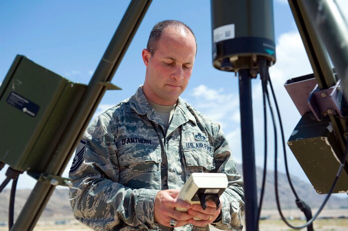 Master Sgt. Adam D'Anthony, 57th Operations Support Squadron airfield weather support NCO in charge, tests a AN/TMO-53, Tactical Meteorological Observation Set July 28, 2014, at Nellis Air Force Base, Nev. Weather forecasters use this device at home-station and abroad to measure various weather movements. (U.S. Air Force photo by Senior Airman Christopher Tam)