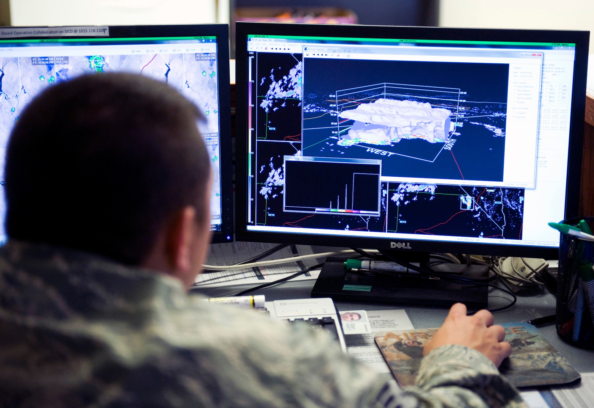 Staff Sgt. Jarad Guerrero-Salinas, 57th Operations Support Squadron shift supervisor, observes a thunderstorm using a Gibson Ridge Radar, July 28, 2014, at Nellis Air Force Base, Nev. Gibson Ridge Radars are used to predict possible thunderstorms, precipitation and how severe they are. (U.S. Air Force photo by Airman 1st Class Rachel Loftis)