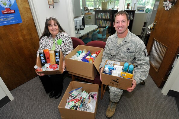 The Arnold Engineering Development Complex (AEDC) Casualty Assistance Office collected comfort items for the veterans receiving assistance from the Tennessee Valley Healthcare System hospitals and homeless support programs. Autumn Standley (left) and Master Sgt. George Allen display some of the items received from AEDC personnel as they prepare to deliver the items to the Murfreesboro VA location on July 10. (Photo by Rick Goodfriend)