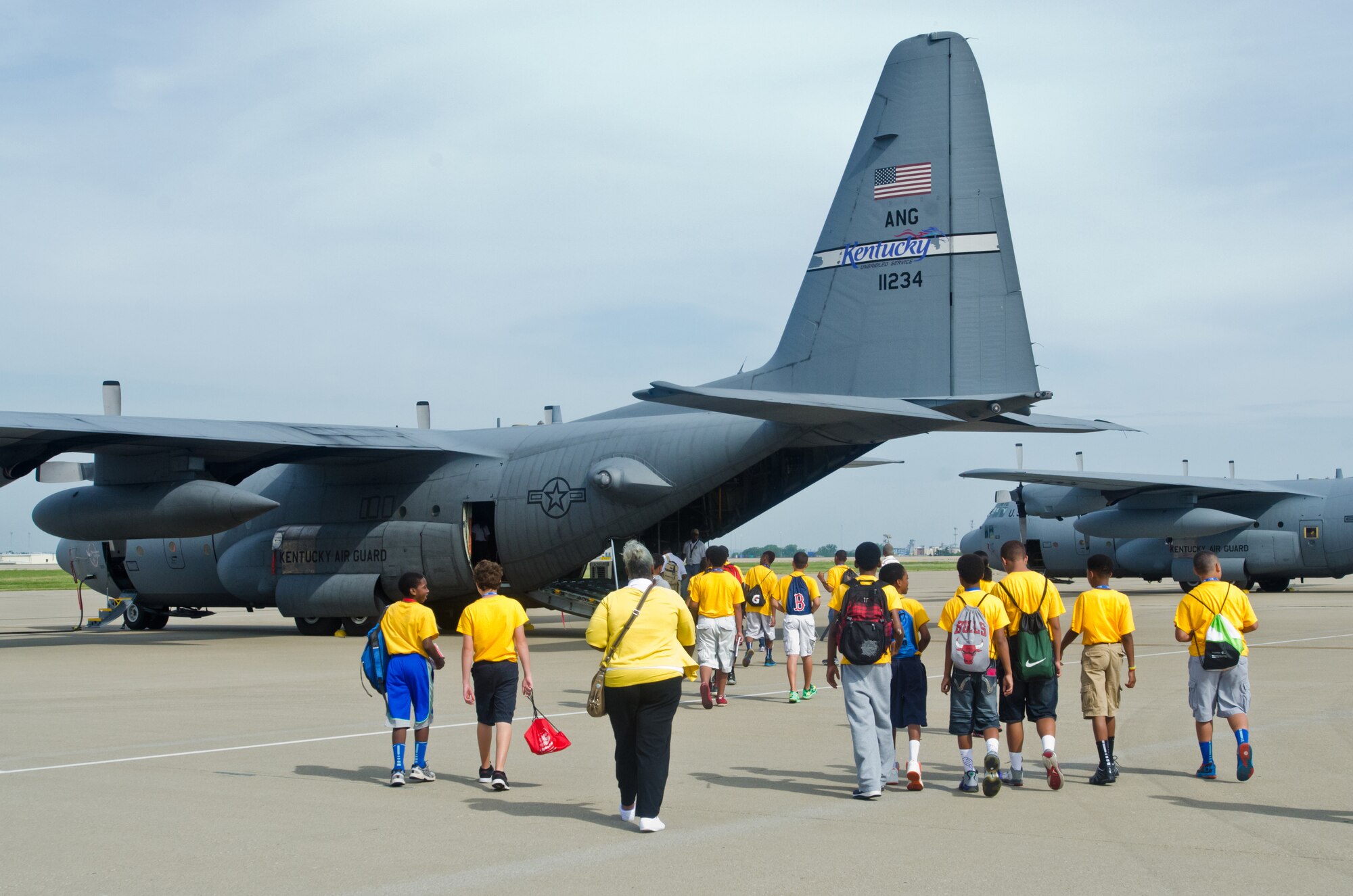 A group of local youths tour the flight line of the Kentucky Air National Guard Base in Louisville, Ky., on June 20, 2014. The visit was part of an aviation camp sponsored by the Organization of Black Aerospace Professionals designed to stimulate interest in the aerospace community. (U.S. Air National Guard photo by Senior Airman Joshua Horton)