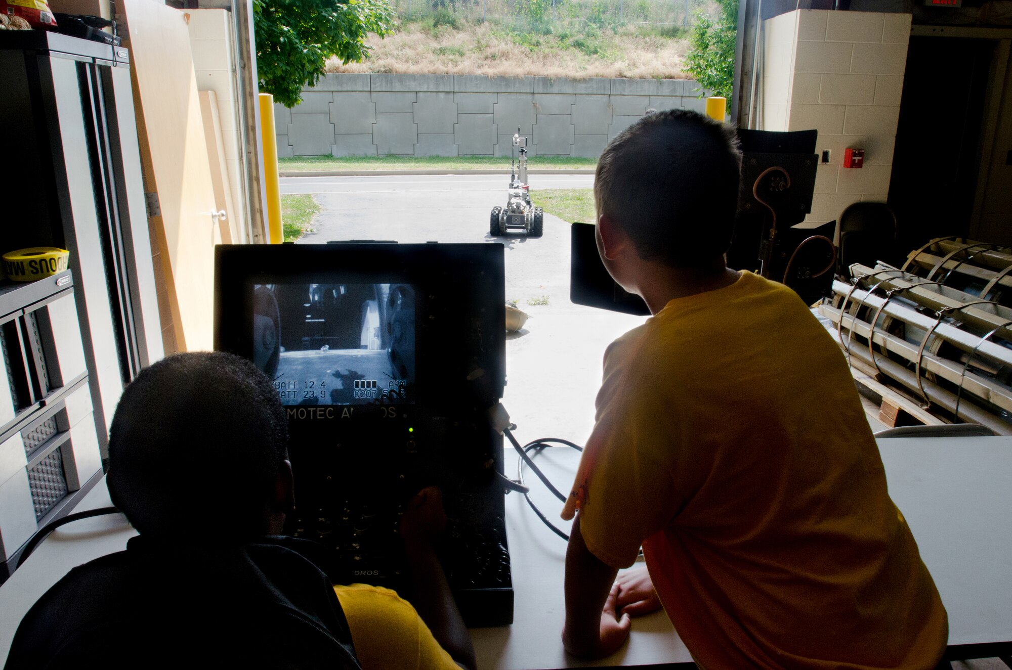 Local youth operate an Explosive Ordinance Disposal robot during a tour of the Kentucky Air National Guard’s 123rd Airlift Wing in Louisville, Ky., on June 20, 2014. The visit was part of an aviation camp sponsored by the Organization of Black Aerospace Professionals designed to stimulate interest in the aerospace community. (U.S. Air National Guard photo by Senior Airman Joshua Horton)