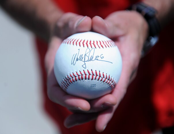 Maj. Gen. Jay Silveria, U.S. Air Force Warfare Center commander, holds a baseball signed by Wally Backman, the Las Vegas 51s manager, before the team’s game against the Salt Lake Bees at Cashman Field in Las Vegas, Nev., July 27, 2014. Silveria, who has has been a fan of the 51s’ manager since Backman played second base for the New York Mets, used the ball to throw out the game’s ceremonial first pitch. (U.S. Air Force photo by Staff Sgt. Siuta B. Ika)