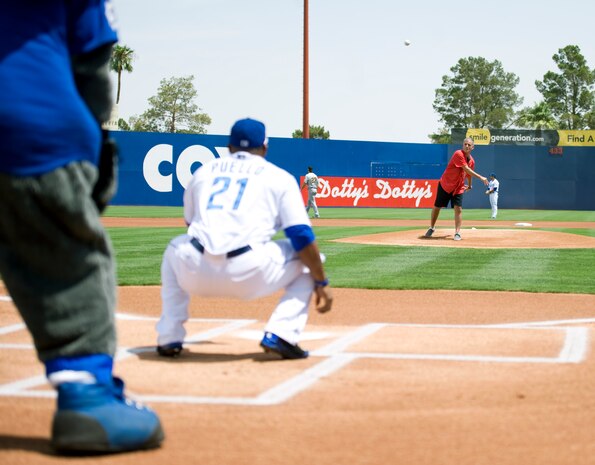 Maj. Gen. Jay Silveria, U.S. Air Force Warfare Center commander, throws the first pitch at the Las Vegas 51s’ game against the Salt Lake Bees at Cashman Field in Las Vegas, Nev., July 27. Before the game, Silveria mingled with 51s’ players and other members of the organization. (U.S. Air Force Photo by Airman 1st Class Mikaley P.Towle)