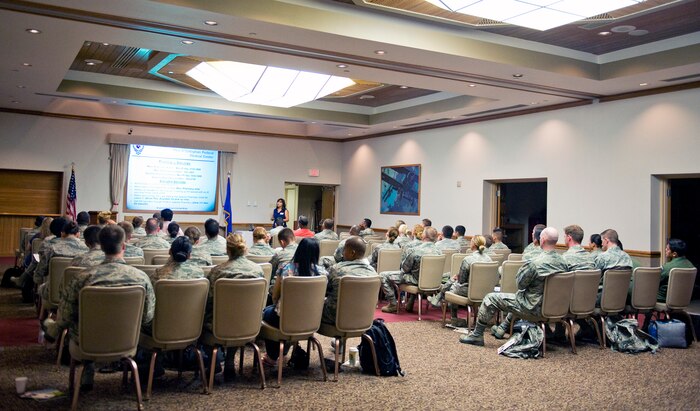 Incoming members of the Nellis community gather together for a Right Start Newcomers Orientation briefing at The Club, July 24, 2014, at Nellis Air Force Base, Nev. During the peak permanent change of station season, approximately 750 people attend Right Start, and each week approximately 50 people attend to in-process, visit vendors at the information fair, and receive briefings from select base agencies. (U.S. Air Force photo by Airman 1st Class Rachel Loftis)
