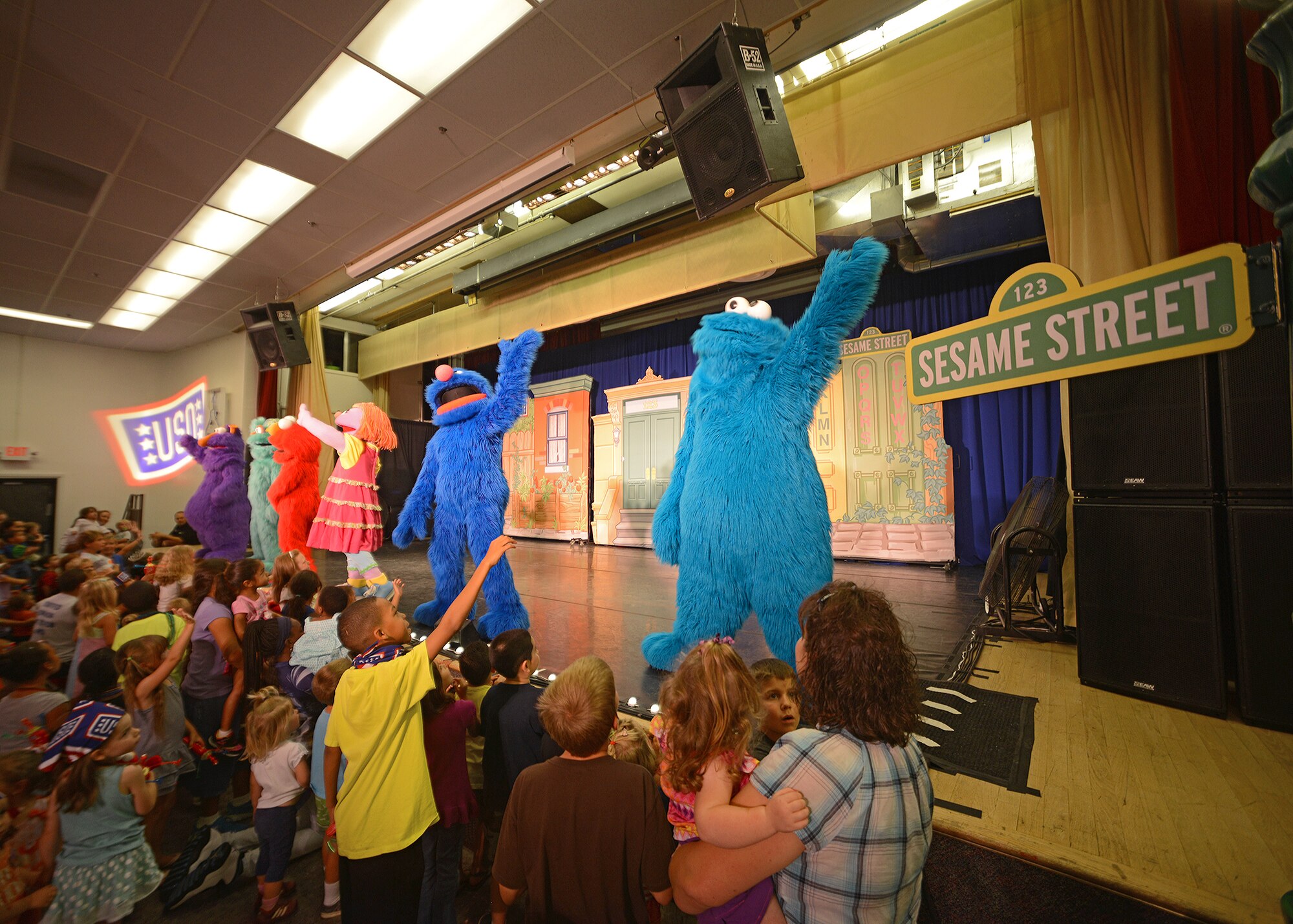 Of the characters in attendance, military children were greeted by Elmo, Grover, Rosita, Honker and Cookie Monster, to include a special character named Katie, during the "Sesame Street USO Experience for Military Families" July 28 at the Oasis Community Center. (U.S. Air Force photo by Jet Fabara)